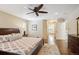 Inviting bedroom featuring hardwood floors, a ceiling fan, and large windows at 5320 S Geneva St, Englewood, CO 80111