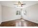 Spacious bedroom with two windows providing lots of natural light and beautiful hardwood floors at 5320 S Geneva St, Englewood, CO 80111