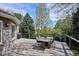Expansive outdoor deck featuring wrought iron railing and a stone dining table with chairs at 5320 S Geneva St, Englewood, CO 80111