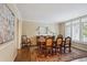 Elegant dining room with hardwood floors, large window, and a patterned rug at 5320 S Geneva St, Englewood, CO 80111