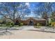 Attractive community center with brick facade, mature trees, and landscaped grounds at 5320 S Geneva St, Englewood, CO 80111