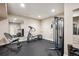 Basement gym featuring workout equipment, rubber flooring, and mirrors for training at 5320 S Geneva St, Englewood, CO 80111