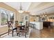 Open concept kitchen with a breakfast nook and a view of the backyard at 5320 S Geneva St, Englewood, CO 80111