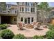 Stone patio with a cozy fire pit and comfortable seating, perfect for outdoor gatherings at 5320 S Geneva St, Englewood, CO 80111