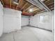 Unfinished basement featuring concrete floor, insulated walls and ceiling, and window at 15350 W 50Th Dr, Golden, CO 80403