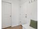 Practical entryway with tile floor, coat hooks, and bench seating offering storage solutions by the doors at 15350 W 50Th Dr, Golden, CO 80403