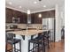 Elegant kitchen with a center island, stainless steel appliances, and sleek dark cabinetry at 15350 W 50Th Dr, Golden, CO 80403