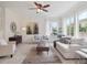 Bright living room with stylish seating, an area rug, and plenty of natural light at 15350 W 50Th Dr, Golden, CO 80403