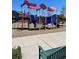 Colorful playground with climbing structures and slides, perfect for to stay active and socialize in this community at 15350 W 50Th Dr, Golden, CO 80403
