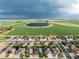 Residential area surrounded by vast farmland and a tranquil lake at 2746 Stallion Way, Mead, CO 80542