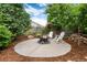 A backyard featuring comfortable outdoor seating around a fire pit with professional landscaping at 2746 Stallion Way, Mead, CO 80542