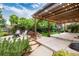Outdoor patio featuring a pergola, custom landscaping, and outdoor seating at 2746 Stallion Way, Mead, CO 80542