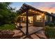 Exterior shot of lighted pergola and patio, perfect for evening relaxation or entertaining at 2746 Stallion Way, Mead, CO 80542