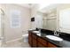 Updated bathroom featuring a double vanity, dark countertops, and a glass enclosed shower at 2746 Stallion Way, Mead, CO 80542