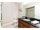Bathroom featuring a granite countertop, under-mount sink, and a large mirror at 2746 Stallion Way, Mead, CO 80542