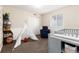 Cozy bedroom with teepee, gray changing table, and comfortable decor at 2746 Stallion Way, Mead, CO 80542