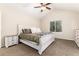 Comfortable bedroom with vaulted ceilings, ceiling fan, and a large window with natural lighting at 2746 Stallion Way, Mead, CO 80542