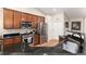 Modern kitchen with stainless steel appliances and beautiful wooden cabinetry at 2746 Stallion Way, Mead, CO 80542