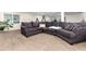 Spacious and comfortable basement living room with plush seating and bright lighting at 2746 Stallion Way, Mead, CO 80542