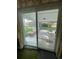 Back patio view through a sliding glass door at 6552 S Pearl St, Centennial, CO 80121