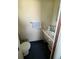 Compact bathroom featuring a pedestal sink and basic fixtures at 6552 S Pearl St, Centennial, CO 80121