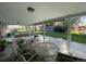 Covered patio featuring a round glass table and cushioned seating, perfect for outdoor entertaining at 6552 S Pearl St, Centennial, CO 80121