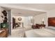 Spacious bedroom with ample natural light, a work desk, and neutral carpeting throughout at 4001 Kalamath St, Denver, CO 80211