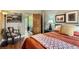 Cozy bedroom showcasing an ornate chair and an adjacent bathroom at 4001 Kalamath St, Denver, CO 80211