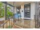 Inviting front porch with wrought iron details and cozy seating at 4001 Kalamath St, Denver, CO 80211