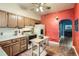 Cozy kitchen featuring natural wood cabinets and an adjacent dining area at 4001 Kalamath St, Denver, CO 80211
