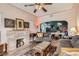 Living room with a decorative fireplace and view to the dining area at 4001 Kalamath St, Denver, CO 80211