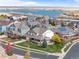 Stunning aerial view of a lakeside community with mature trees and colorful homes with solar panels at 6276 S Robertsdale Ct, Aurora, CO 80016