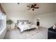 Tranquil bedroom with a large window, a comfortable bed, and an ensuite bathroom at 6276 S Robertsdale Ct, Aurora, CO 80016