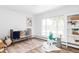Charming Bedroom featuring a crib, plush rug, and natural light from the window at 3801 S Albion St, Englewood, CO 80113