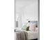 Bright bedroom featuring a plush bed with decorative pillows and soft blanket at 3801 S Albion St, Englewood, CO 80113
