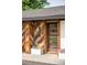 Inviting home entrance with modern door, stylish address display, and decorative planters, enhancing curb appeal and creating a warm welcome at 3801 S Albion St, Englewood, CO 80113