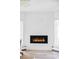 Modern fireplace in a bright living room with plenty of natural light at 3801 S Albion St, Englewood, CO 80113