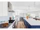 Well-lit, modern kitchen with stainless steel appliances, island, and open layout at 3801 S Albion St, Englewood, CO 80113