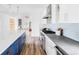 Bright, modern kitchen with stainless steel appliances and a large island with seating at 3801 S Albion St, Englewood, CO 80113