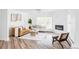 Bright living room with a fireplace, two couches, a chair, and light-colored walls at 3801 S Albion St, Englewood, CO 80113