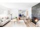 Spacious living room with hardwood floors, fireplace, and seamless flow to the kitchen, ideal for entertaining and Gathering gatherings at 3801 S Albion St, Englewood, CO 80113