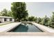 Backyard pool with a large, inviting pool area and mature trees at 3801 S Albion St, Englewood, CO 80113