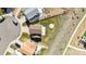 Aerial view of the home showcasing the expansive backyard, lush lawn, concrete patio and wooden fence at 9665 Bighorn Way, Littleton, CO 80125