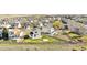 Backyard aerial view showcasing a green lawn and wooden fence at 9665 Bighorn Way, Littleton, CO 80125