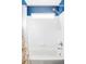 Bathroom with a shower and tub combination and blue trim at 9665 Bighorn Way, Littleton, CO 80125