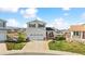 Charming two-story home with well-manicured lawn, a welcoming porch, and an attached two-car garage at 9665 Bighorn Way, Littleton, CO 80125