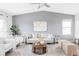 Bright living room with high ceilings, stylish furnishings, and ample natural light at 9665 Bighorn Way, Littleton, CO 80125