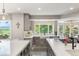 Bright, open kitchen featuring light wood cabinets, white countertops, and a large window with scenic views at 11362 W Baltic Ct, Lakewood, CO 80227