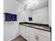 Well-lit bathroom with a spacious vanity and modern features at 1294 S Troy St, Aurora, CO 80012