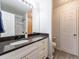 Bright bathroom with a large vanity, ample counter space, and modern fixtures at 1294 S Troy St, Aurora, CO 80012